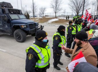 Canada police arrest protesters as key bridge to U.S. remains shut
